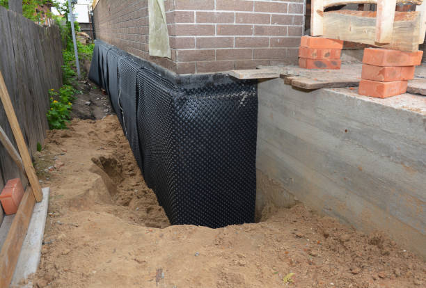 Happy homeowners after waterproofing job in Haywood